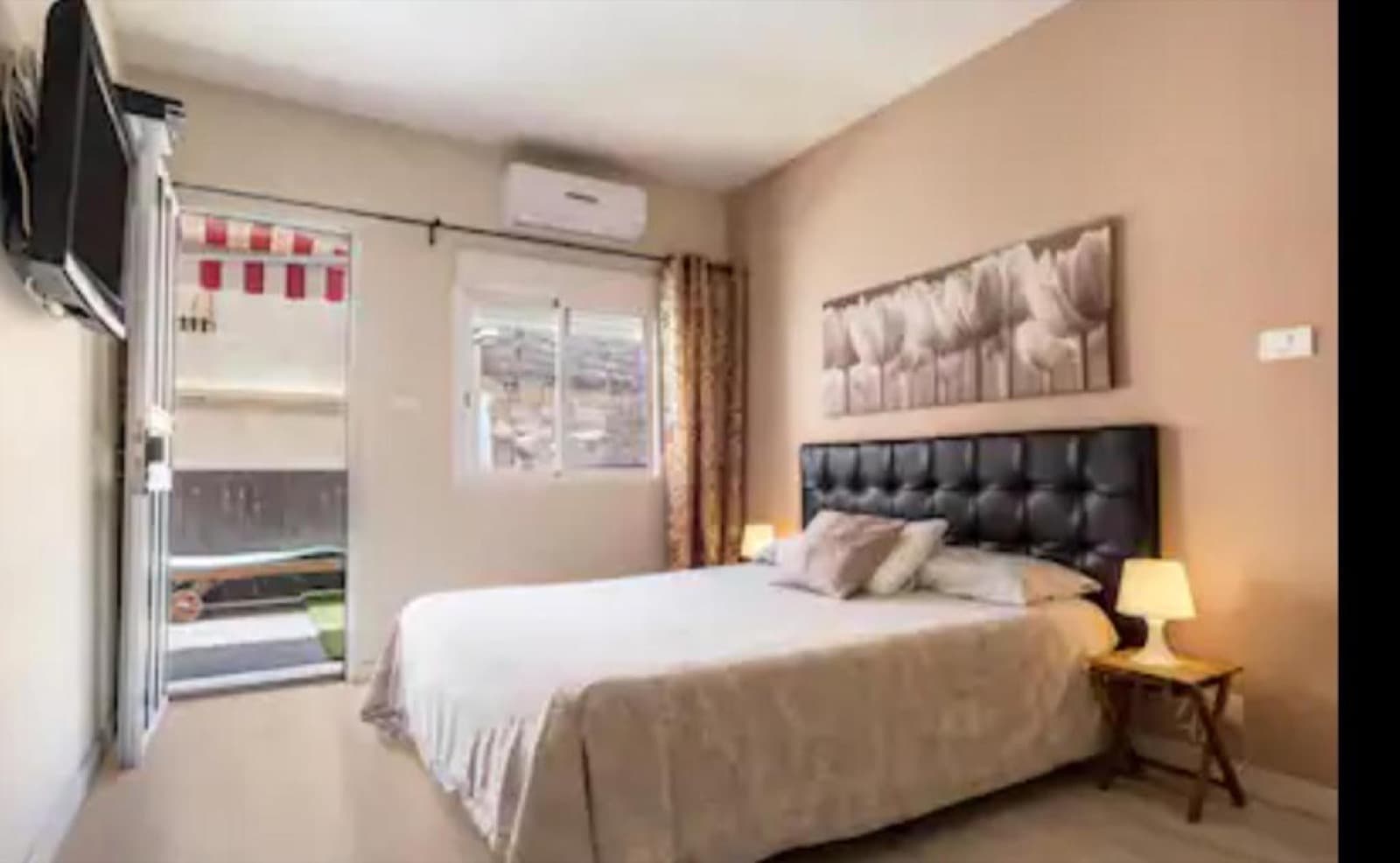 Bedroom with double bed and balcony access
