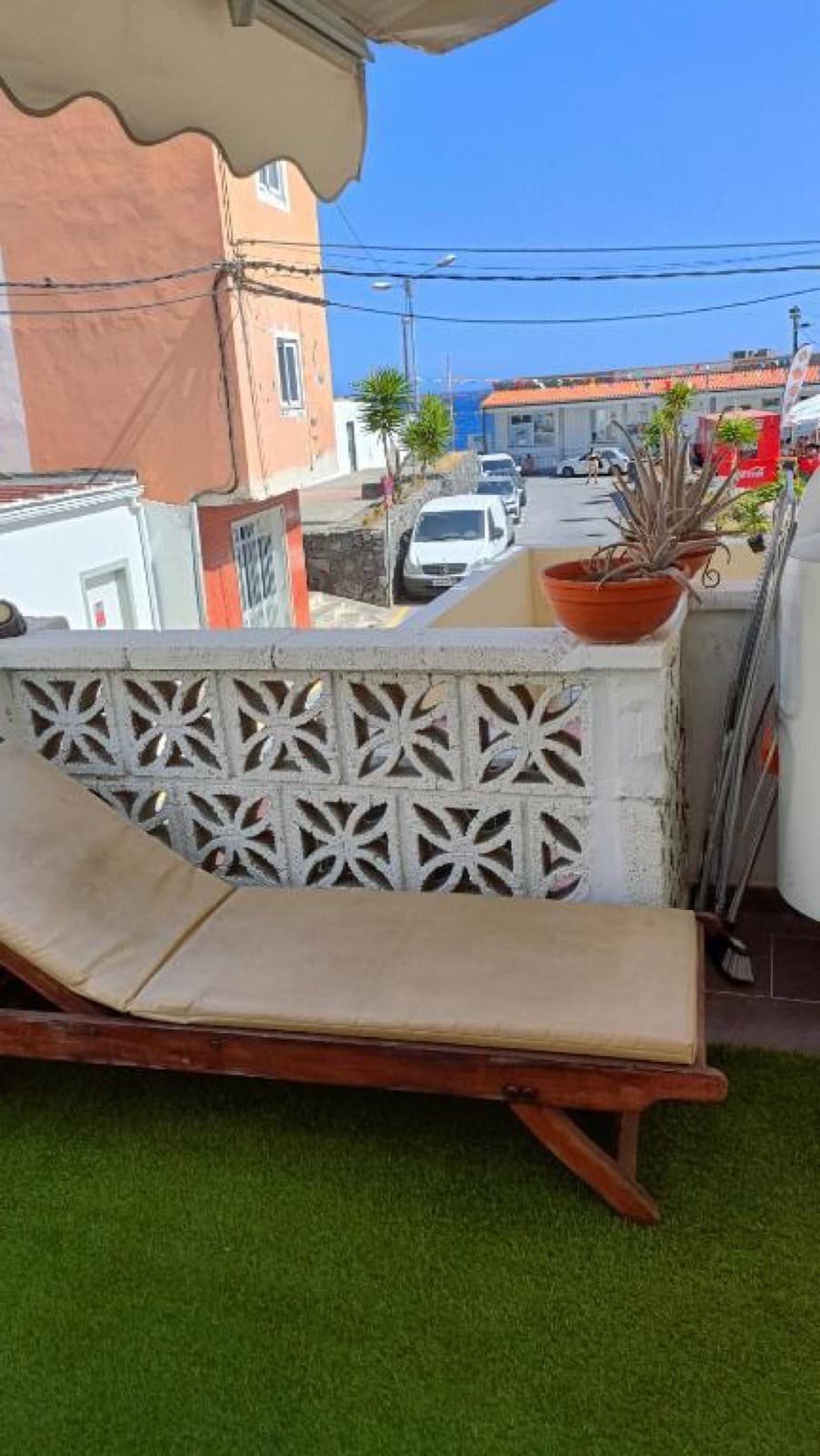Balcony with bistro table and side sea view
